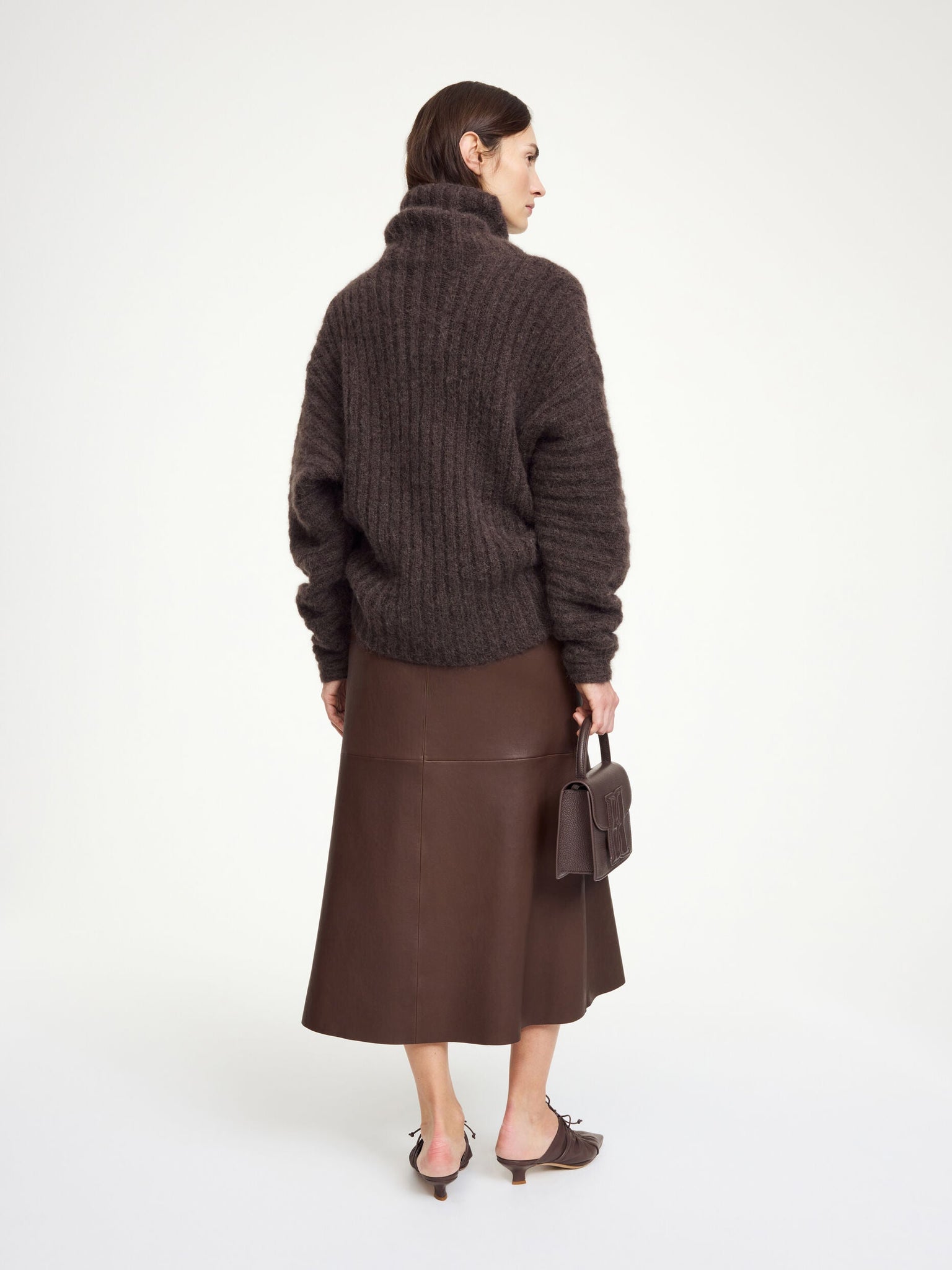 Simoas Leather Skirt in Carafe styled with a casual boxy T-shirt, demonstrating its versatility for everyday wear.