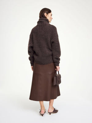 Simoas Leather Skirt in Carafe styled with a casual boxy T-shirt, demonstrating its versatility for everyday wear.