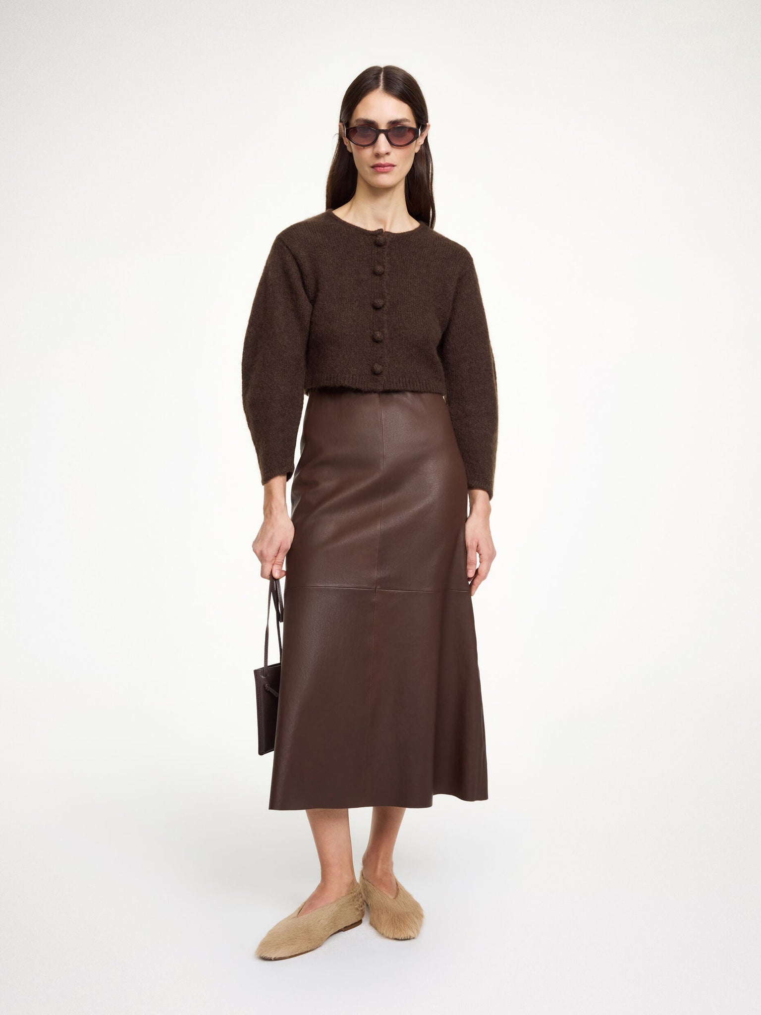 Back view of the Zharea Cardigan in Dark Mahogany, perfect for layering in colder temperatures.