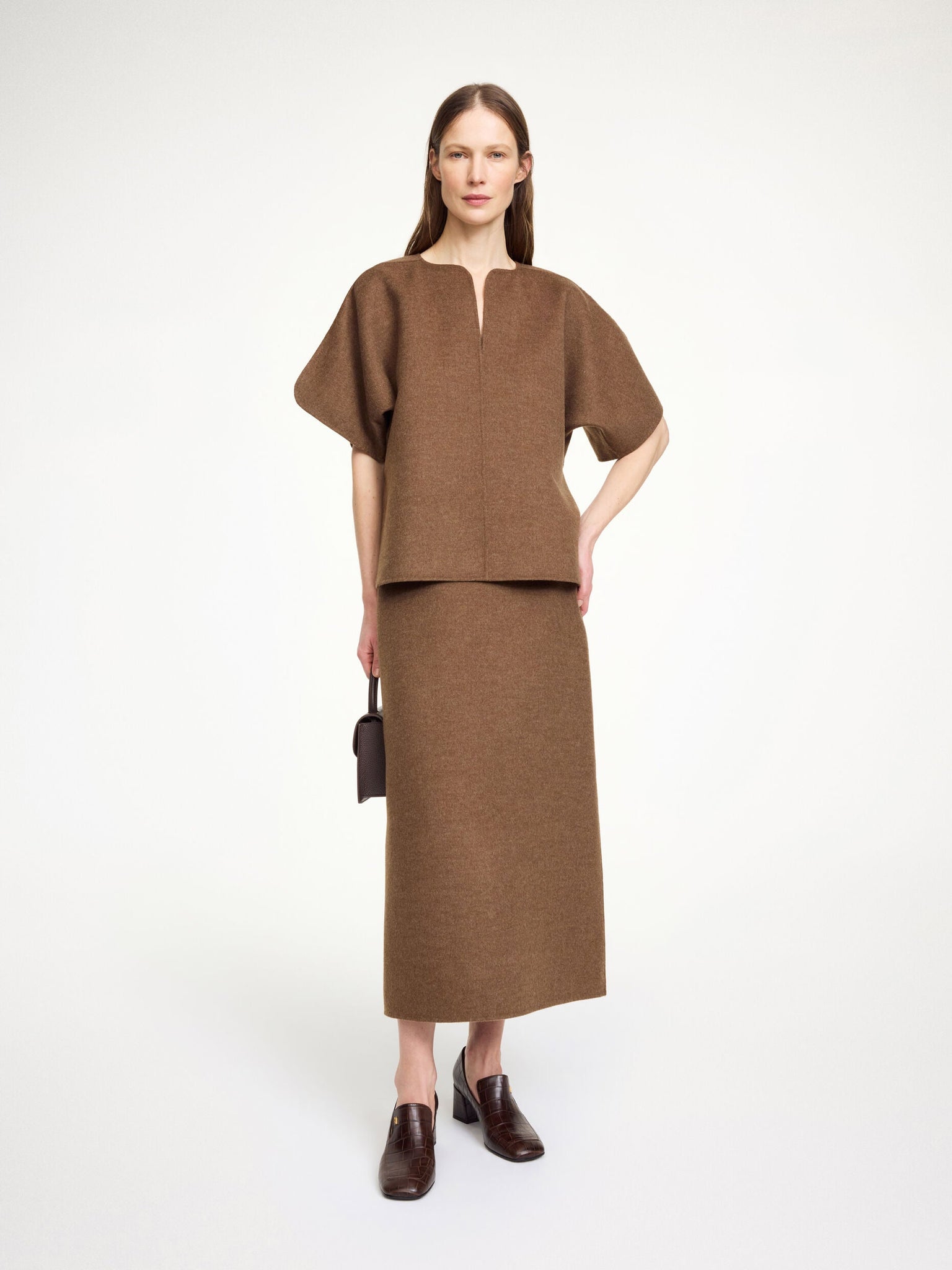 Dark Brown Melange Calle Wool Blouse by By Malene Birger styled with a chic outfit, perfect for colder weather.