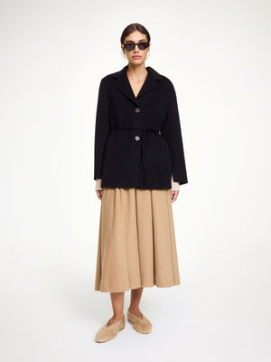Close-up of the Hellen Blazer in Black, highlighting the wool fabric and single-breasted button closure by By Malene Birger.