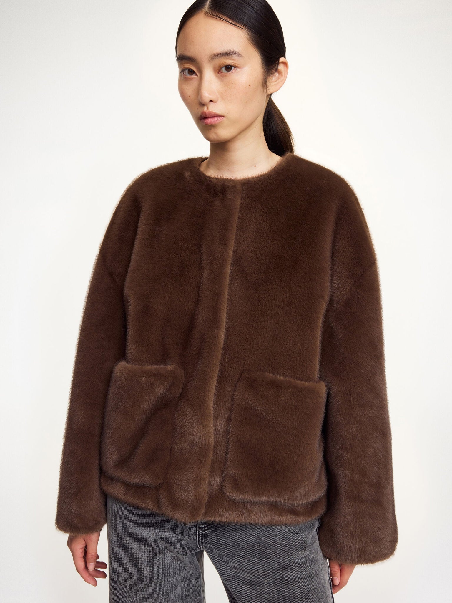Models wearing the Jacquie Faux Fur Jacket in Carafe, styled with chic outfit combinations.