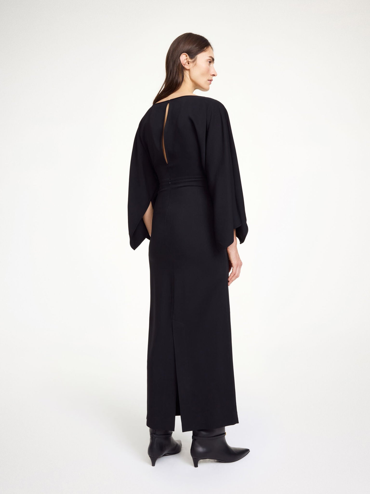 Hella Dress in Black shown in a straight silhouette perfect for after-hours events.