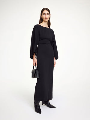 Close-up of Hella Dress in Black highlighting the exposed back and discreet zipper.