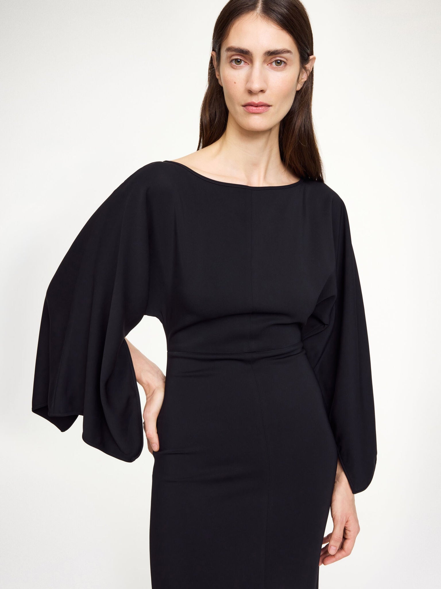 Model wearing Hella Dress in Black showcasing its chic and timeless design.