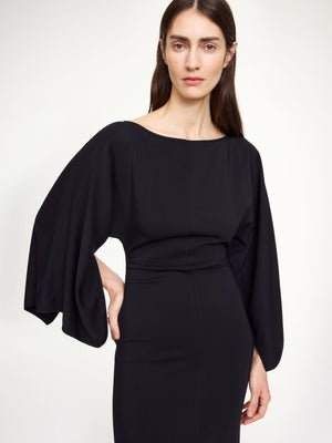 Model wearing Hella Dress in Black showcasing its chic and timeless design.