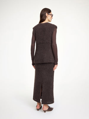 Model wearing the Revna Vest in Carafe, paired for a cozy autumn look with stylish layers.