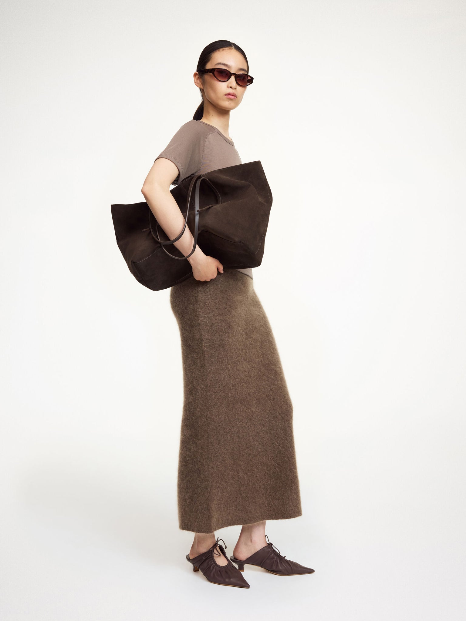 Close-up of the Estille Skirt in Chocolate Chip by By Malene Birger, showcasing its elastic waist and rich texture.