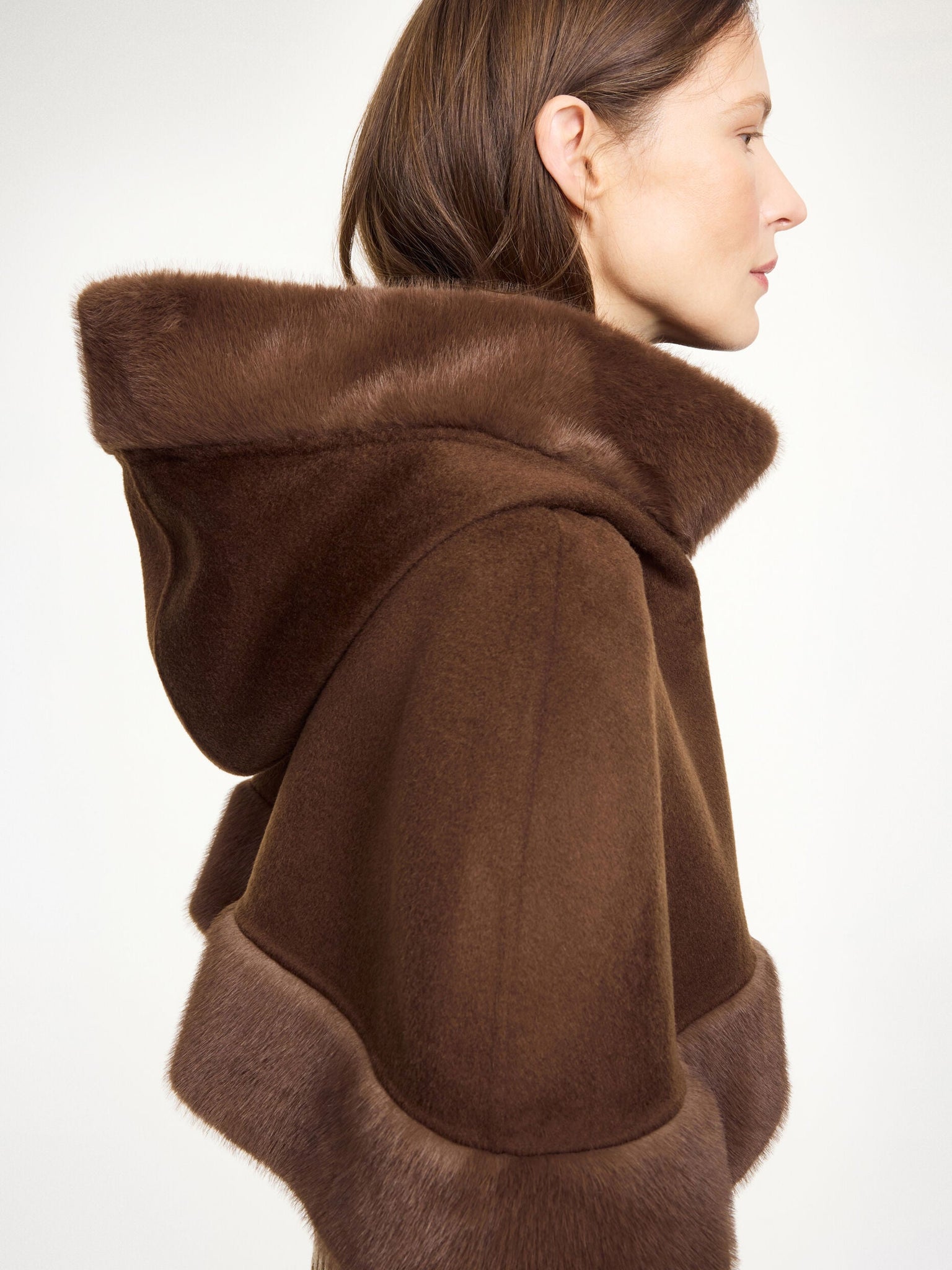Close-up of the Marta Wool Cape in Carafe showcasing the rich texture of 100% wool and the luxurious faux fur trim detail.