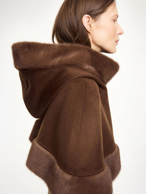 Close-up of the Marta Wool Cape in Carafe showcasing the rich texture of 100% wool and the luxurious faux fur trim detail.