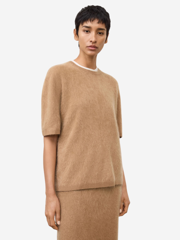Model wearing the Maren Sweater in Toffee, featuring a crew neck and short sleeves for a casual look.