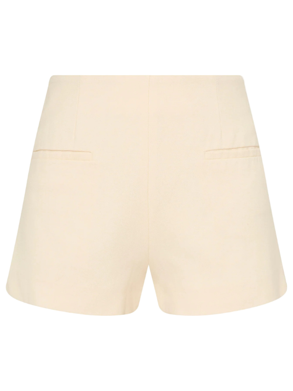 Florine Mini Short in Latte by Faithfull, showcasing its mid-rise design and soft tailoring fabric.