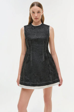 Full view of the Audrina Jacquard Mini Dress in Black on a hanger, perfect for any modern wardrobe.