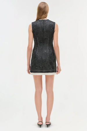 Back view of the Audrina Jacquard Mini Dress in Black by Simkhai, illustrating the detail in construction and fit.