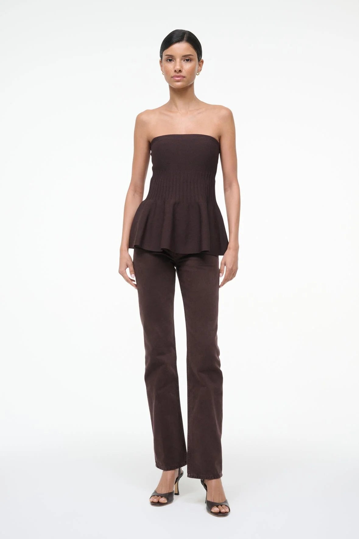 Close-up of the Staud Evie Top in Earth showcasing ottoman stitch detailing at the waist.