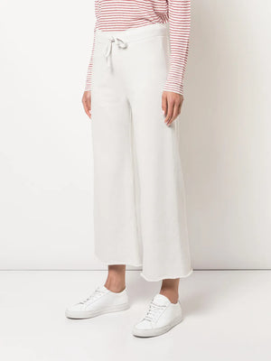 Nili Lotan Kiki Sweatpant in Chalk worn casually, demonstrating its relaxed fit and stylish design for everyday wear.