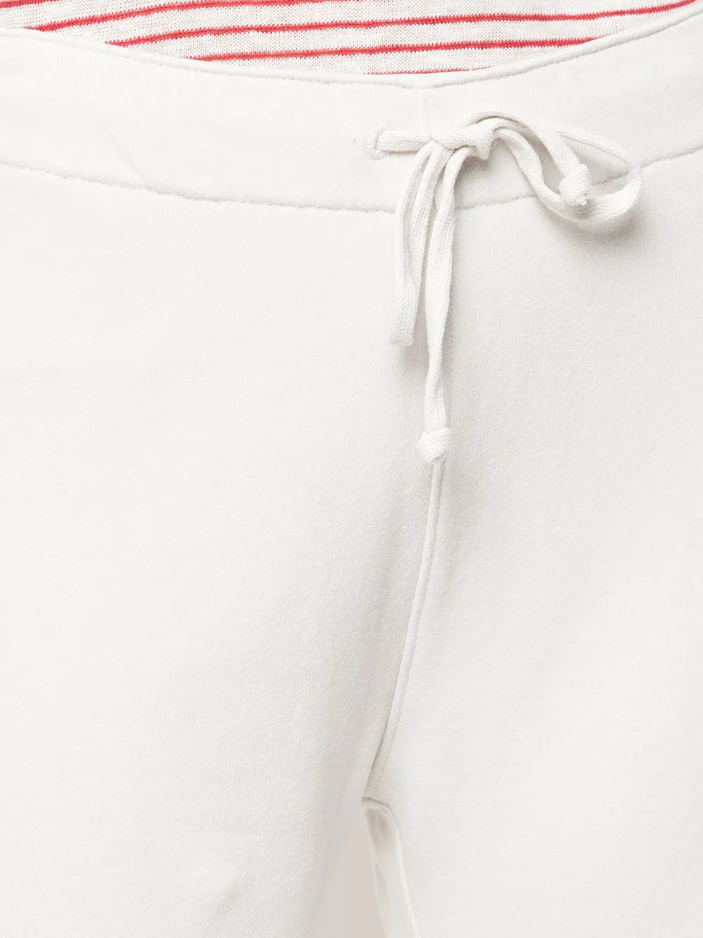 Model in Nili Lotan Kiki Sweatpant in Chalk, illustrating its versatility for home lounging or out-and-about style.