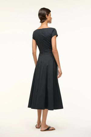 Back view of the Short Sleeve Wells Dress in Black highlighting its elegant design.