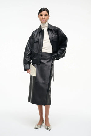 Fashion-forward look featuring the Roman Leather Wrap Skirt in Black by Staud paired with trendy accessories.