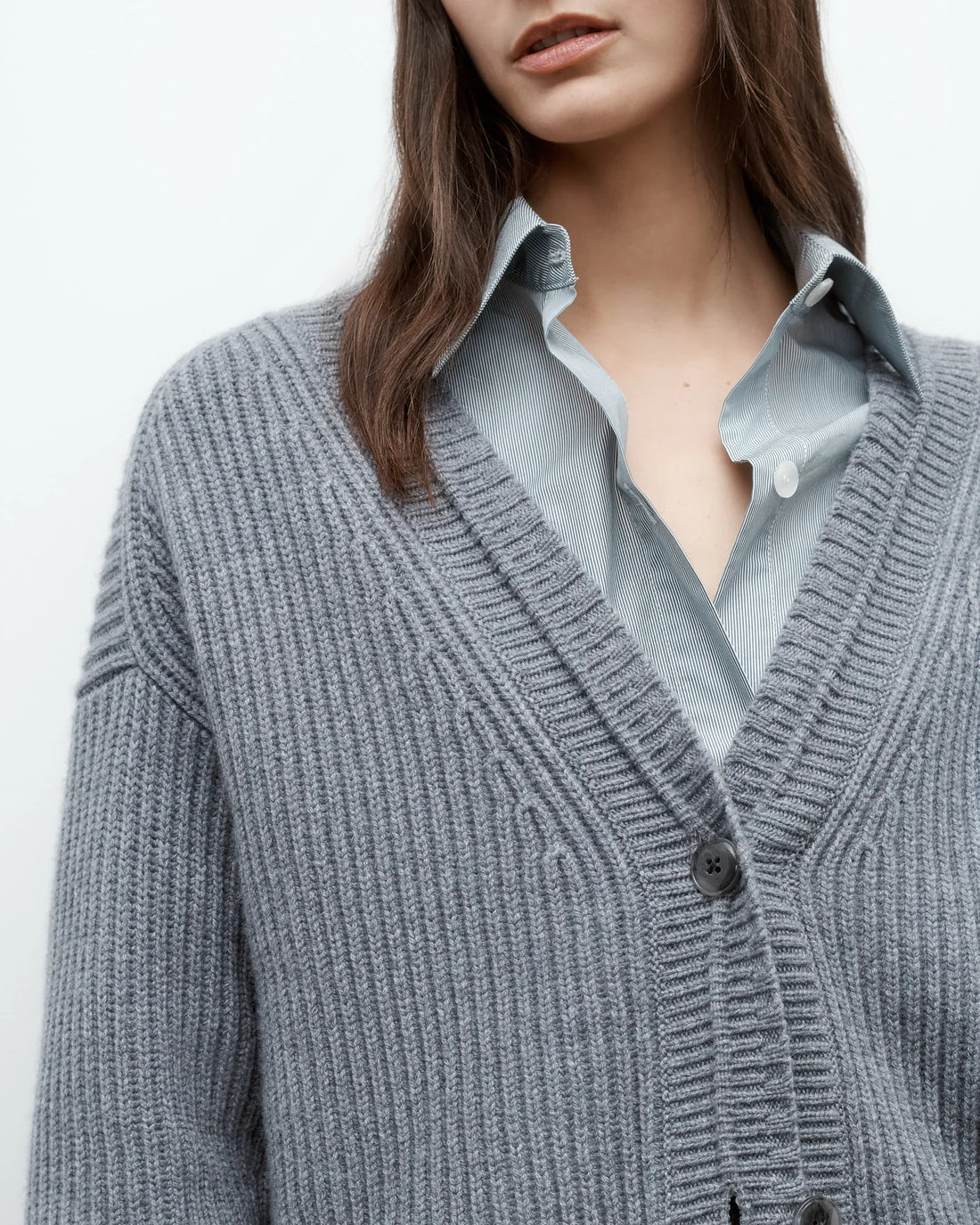 Flat lay of Cardi in Medium Heather Grey against a neutral background showcasing the luxurious cashmere.