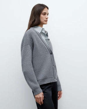 Lifestyle shot of Cardi in Medium Heather Grey worn casually over a white top.