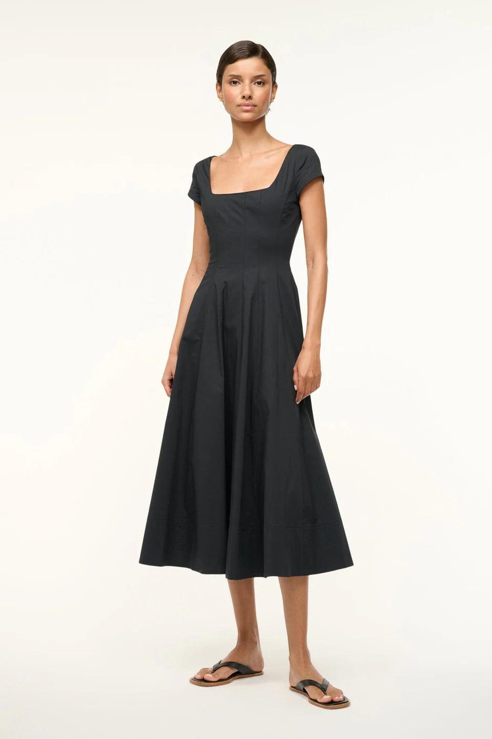 Close-up of the corset-style panel construction of the Short Sleeve Wells Dress in Black.