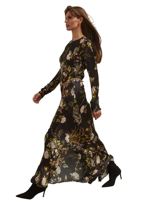 Model wearing the Montgomery Dress in Alfine Gardens Black showcasing its flowy silhouette and luxurious hammered silk texture.