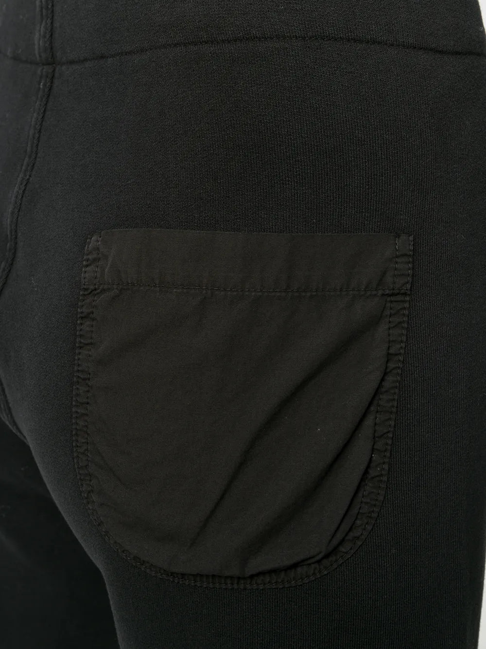 Stylish shot of Kiki Sweatpant in Washed Black, demonstrating its comfortable fit and chic design options.