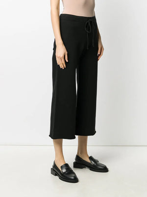 Side view of Kiki Sweatpant in Washed Black, highlighting its relaxed fit and casual style for lounging or errands.