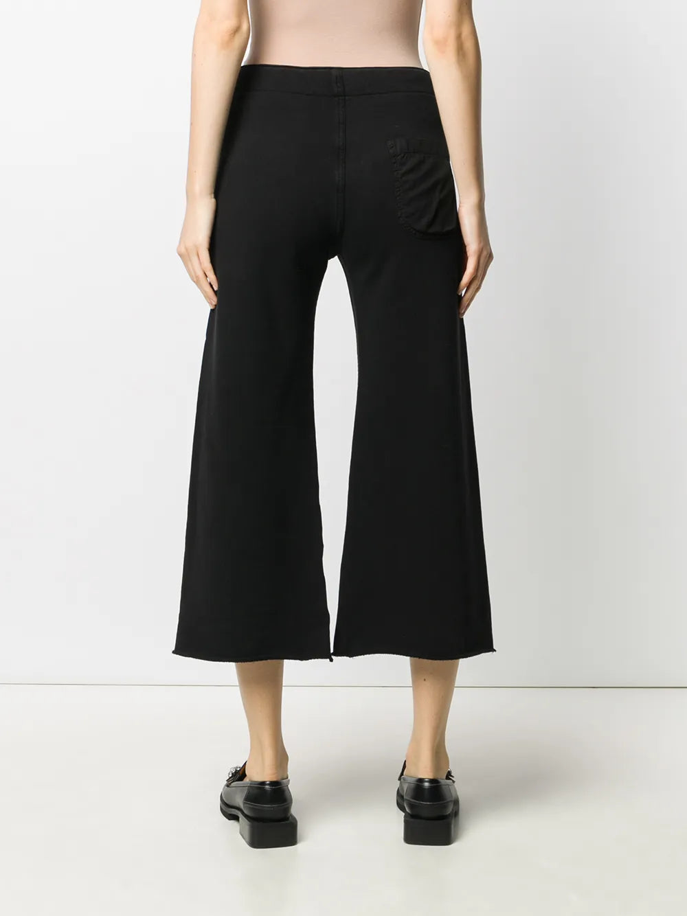 Back view of Nili Lotan Kiki Sweatpant in Washed Black with raw-edge details, perfect for a trendy, laid-back look.