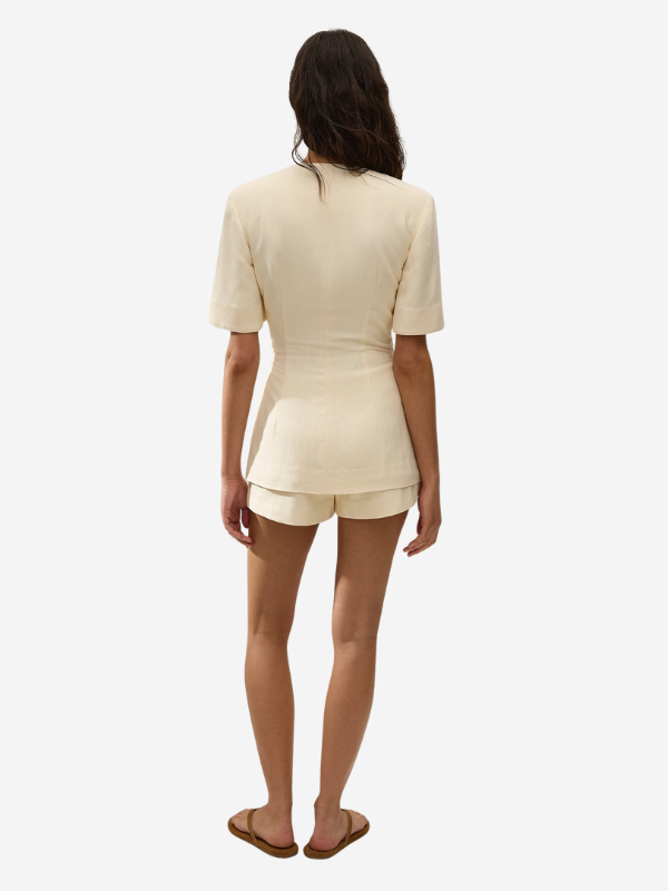 Back view of the Ida Knot Blazer in Latte showing the unique curve hem and relaxed fit.