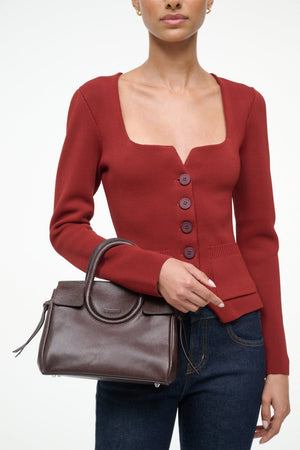Mini Maude Carryall in Espresso displayed with additional accessories to enhance its fashionable appeal.