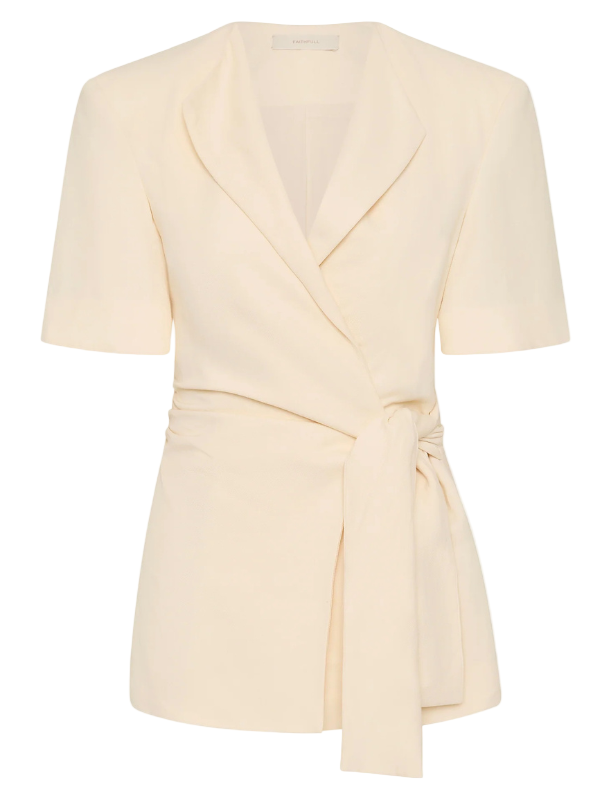 Ida Knot Blazer in Latte displayed on a model showcasing the classic V-neckline and elegant waist tie detail.