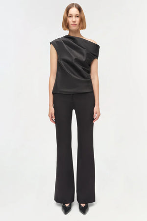 Close-up view of the fabric of the Vivia Taffeta Draped Top in Black, highlighting its luxurious taffeta texture.