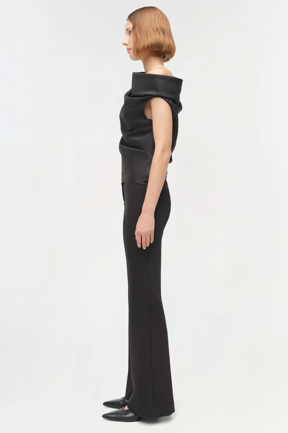 Back view of the Vivia Taffeta Draped Top in Black, revealing its elegant draping style.