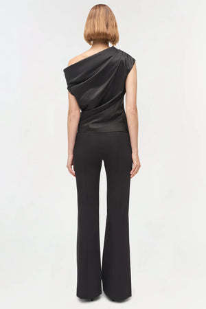Model wearing the Vivia Taffeta Draped Top in Black, styled with chic accessories, perfect for a night out.