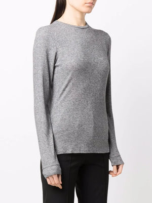 Model wearing Ortigia LDS Ribbed Long Sleeve T-shirt in Grey, demonstrating its versatility as a stand-alone or layered piece.