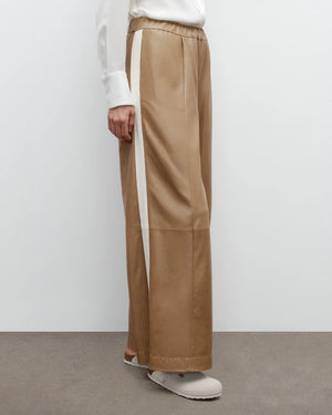 Close-up of the TWP Eva with Tux Pant in Kelp/Bone, showcasing the contrast tux stripe and elastic waistband.