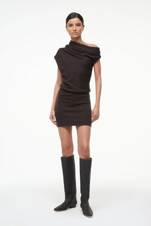 Model wearing the Mabel Mini Dress in Earth by Staud, styled perfectly for a chic autumn look.