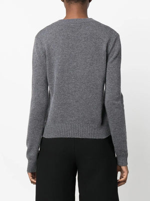 Mable Sweater in Graphite laid out flat, displaying its mid-weight cashmere and ribbed trims.