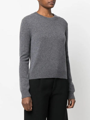Styled shot of the Mable Sweater in Graphite worn with casual outfit, emphasizing its versatility and comfort.