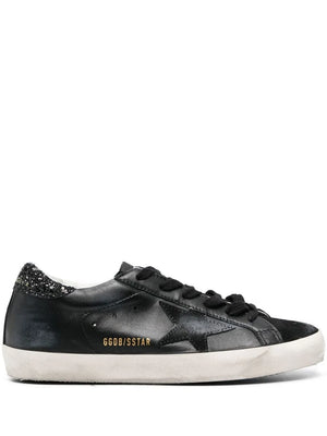 Golden Goose Super-Star in Black featuring a luxurious black nappa leather upper and suede star detail.