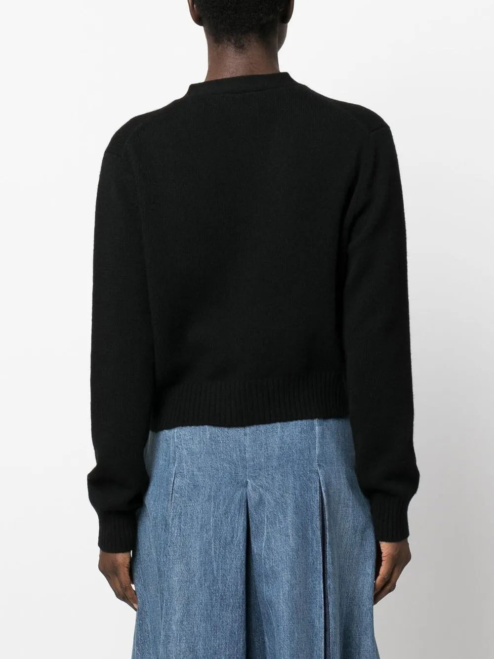 Model wearing the Marion Cardigan in Black styled with casual outfits, emphasizing its versatility and comfort.