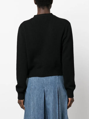 Model wearing the Marion Cardigan in Black styled with casual outfits, emphasizing its versatility and comfort.