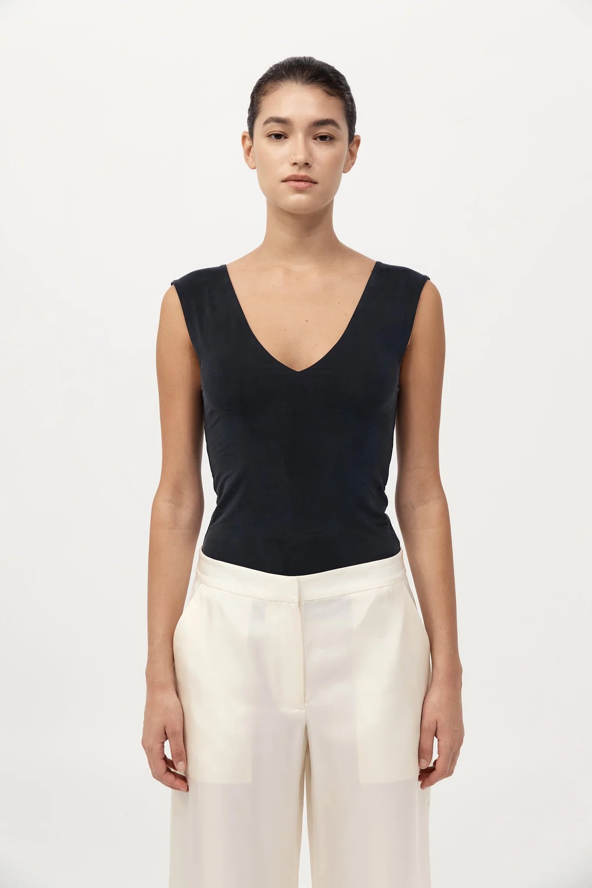 Back view of St. Agni's 90s Cupro Top in Black, demonstrating its elegant double-layer construction for added structure.