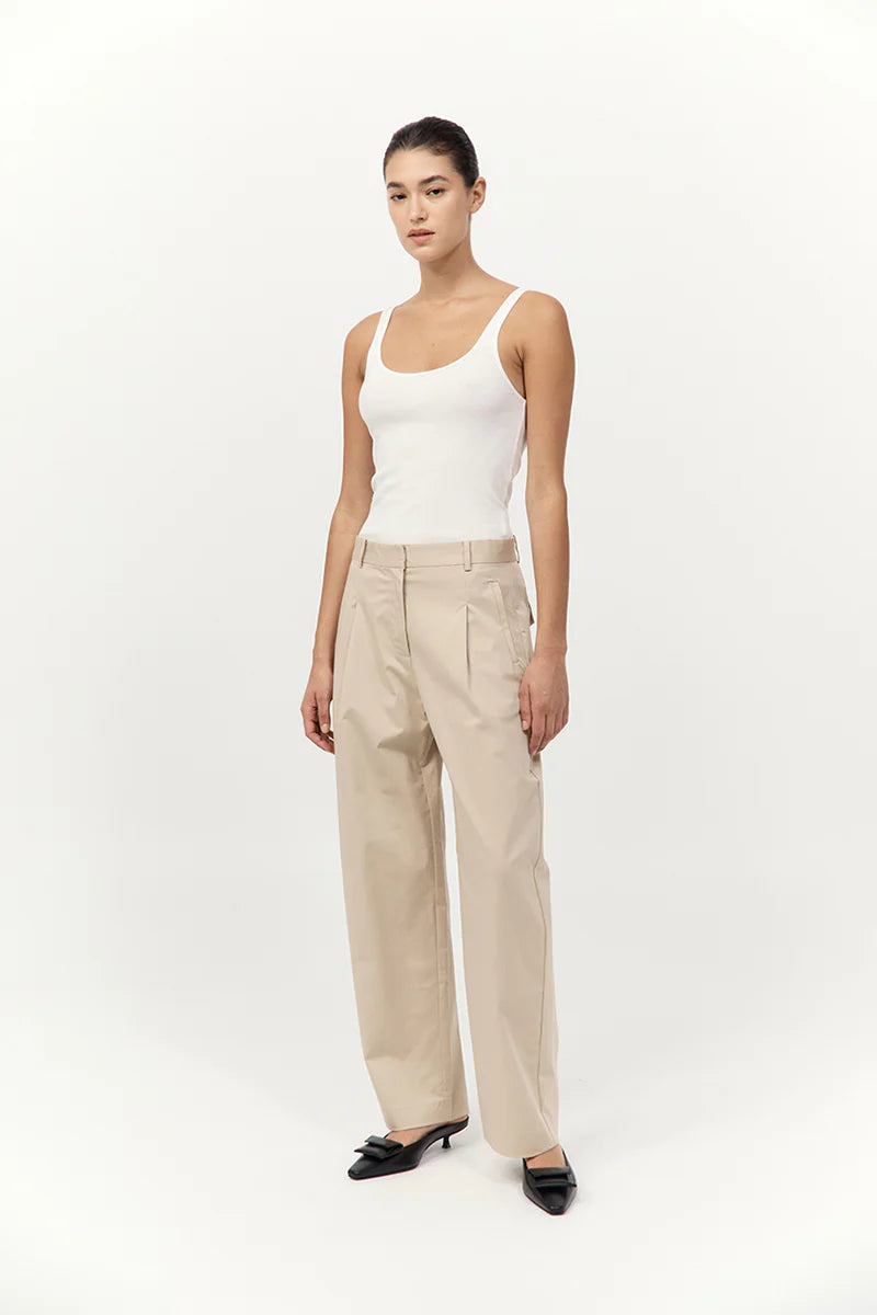 Back view of Cotton Barrel Leg Pants in Champagne, demonstrating the comfortable mid-waist fit and loose barrel leg styling.
