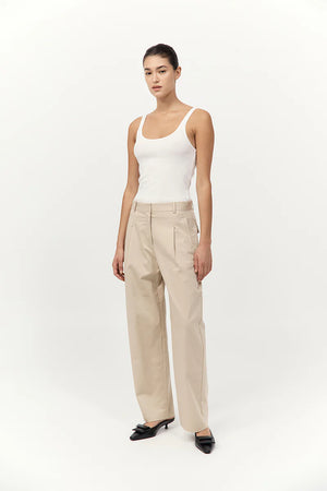 Back view of Cotton Barrel Leg Pants in Champagne, demonstrating the comfortable mid-waist fit and loose barrel leg styling.