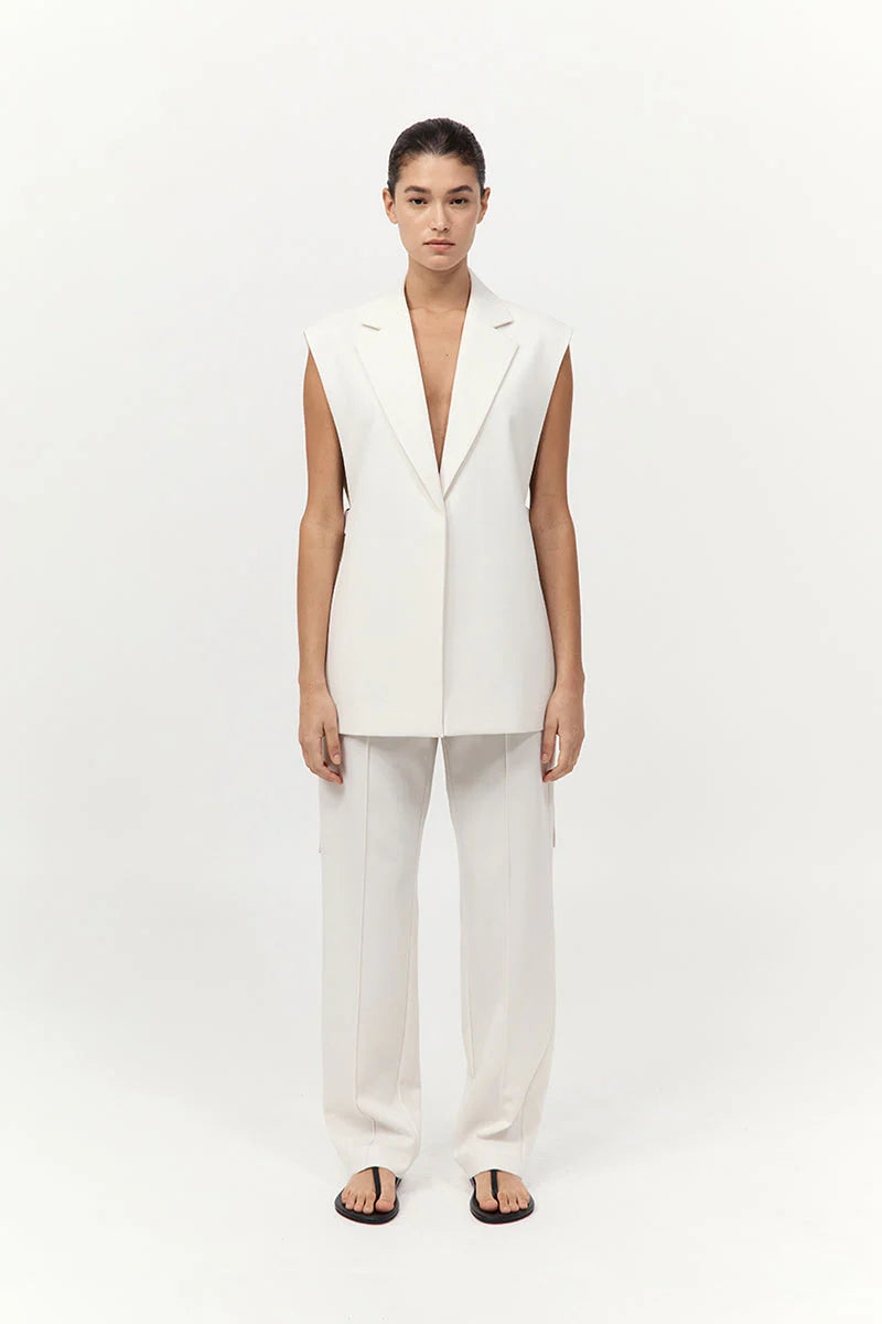 Side view of Relaxed Side Tie Vest in Off White featuring open side seams with ties by St. Agni.