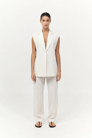 Side view of Relaxed Side Tie Vest in Off White featuring open side seams with ties by St. Agni.
