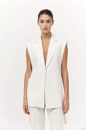 Back view of the Relaxed Side Tie Vest in Off White, designed with an open back and side ties by St. Agni.
